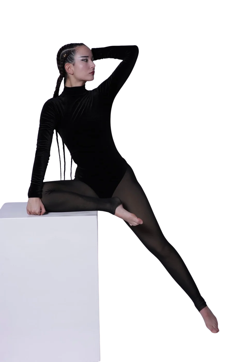 Lena sitting on a white pedestal in black velvet — from her portfolio shoot